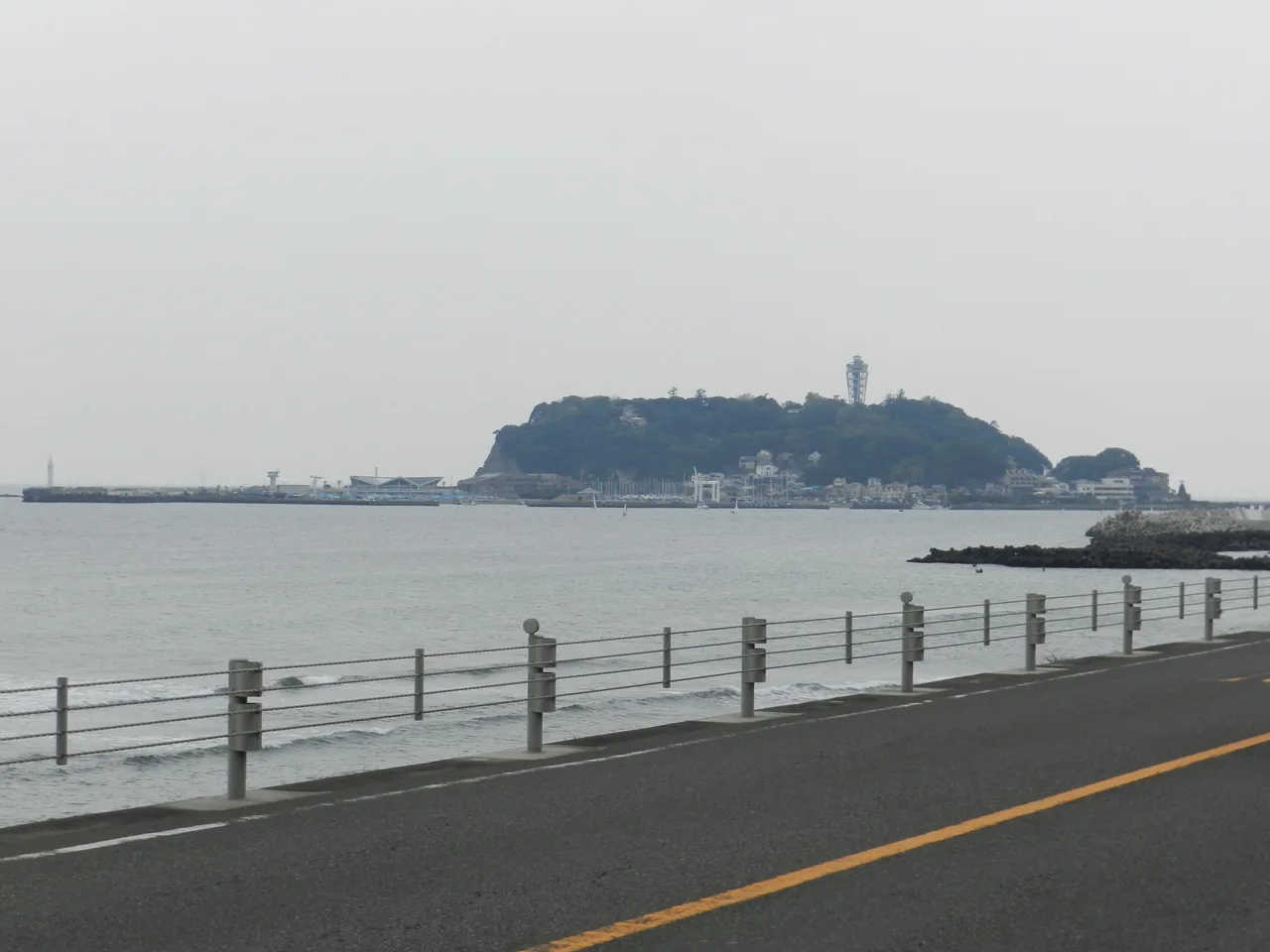 Enoshima seen across the sea from the coast by Kamakurakokomae Station