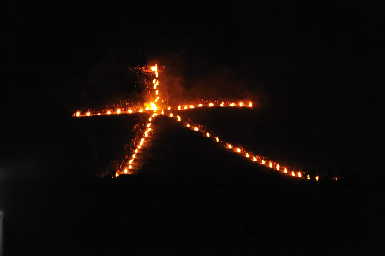 The Daimonji bonfire blazing on a Kyoto mountainside during Obon