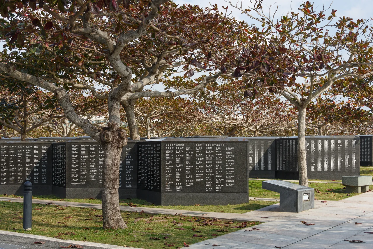 Black granite walls of the Cornerstone of Peace inscribed with the Battle of Okinawa's dead