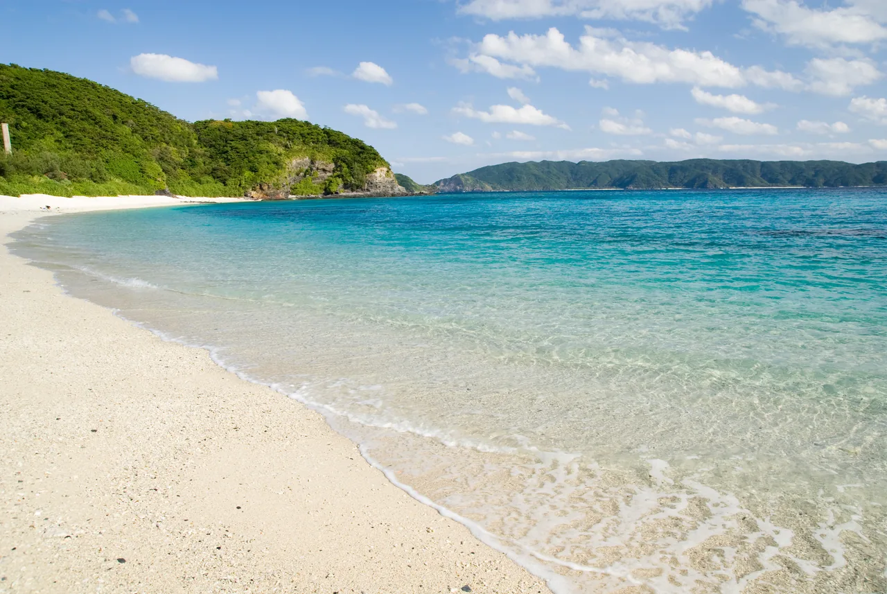 The turquoise Kerama-blue sea and white sand of Furuzamami Beach on Zamami in the Kerama Islands, Okinawa