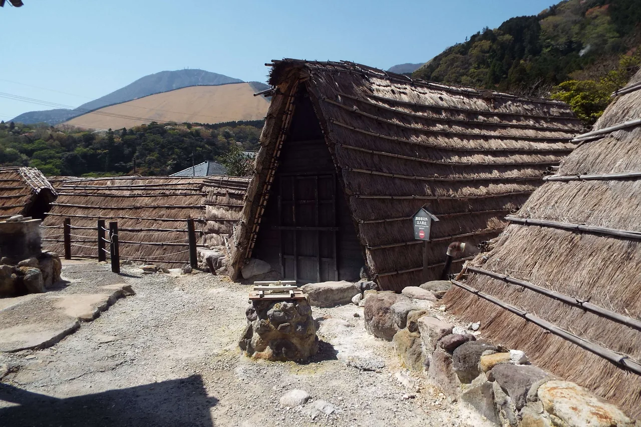 Thatched-roof yunohana huts in Myoban Onsen, Beppu, near the Hoyoland mud baths