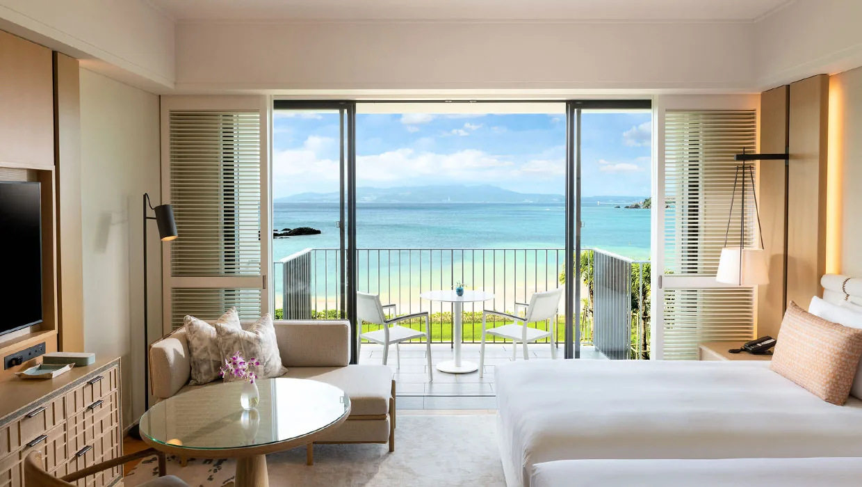 A Deluxe Ocean View room with a private terrace over the sea at Halekulani Okinawa