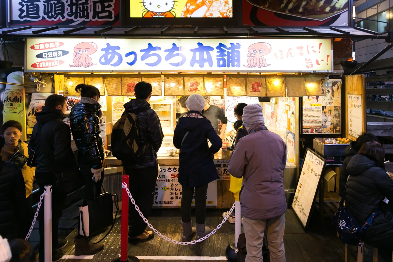 Freshly grilled takoyaki, Osaka's signature street food Freshly grilled takoyaki, Osaka's signature street food