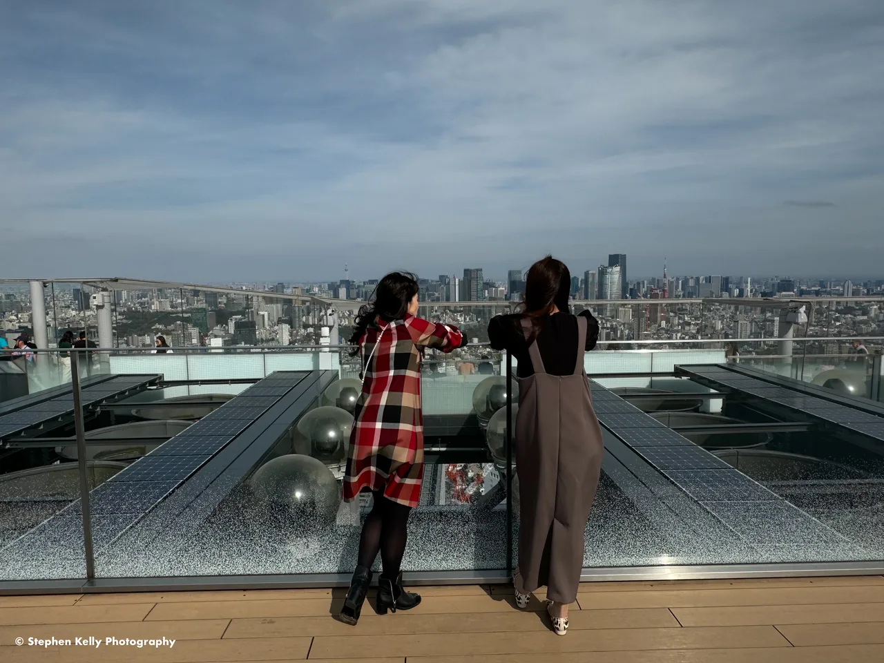 Visitors taking in the view from the Shibuya Sky observation deck Visitors taking in the view from the Shibuya Sky observation deck