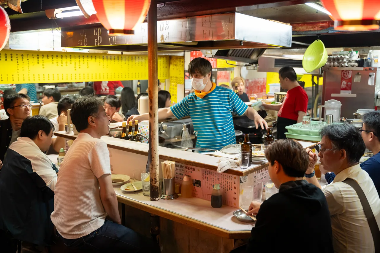 A yakitori stall counter inside Omoide Yokocho, Shinjuku