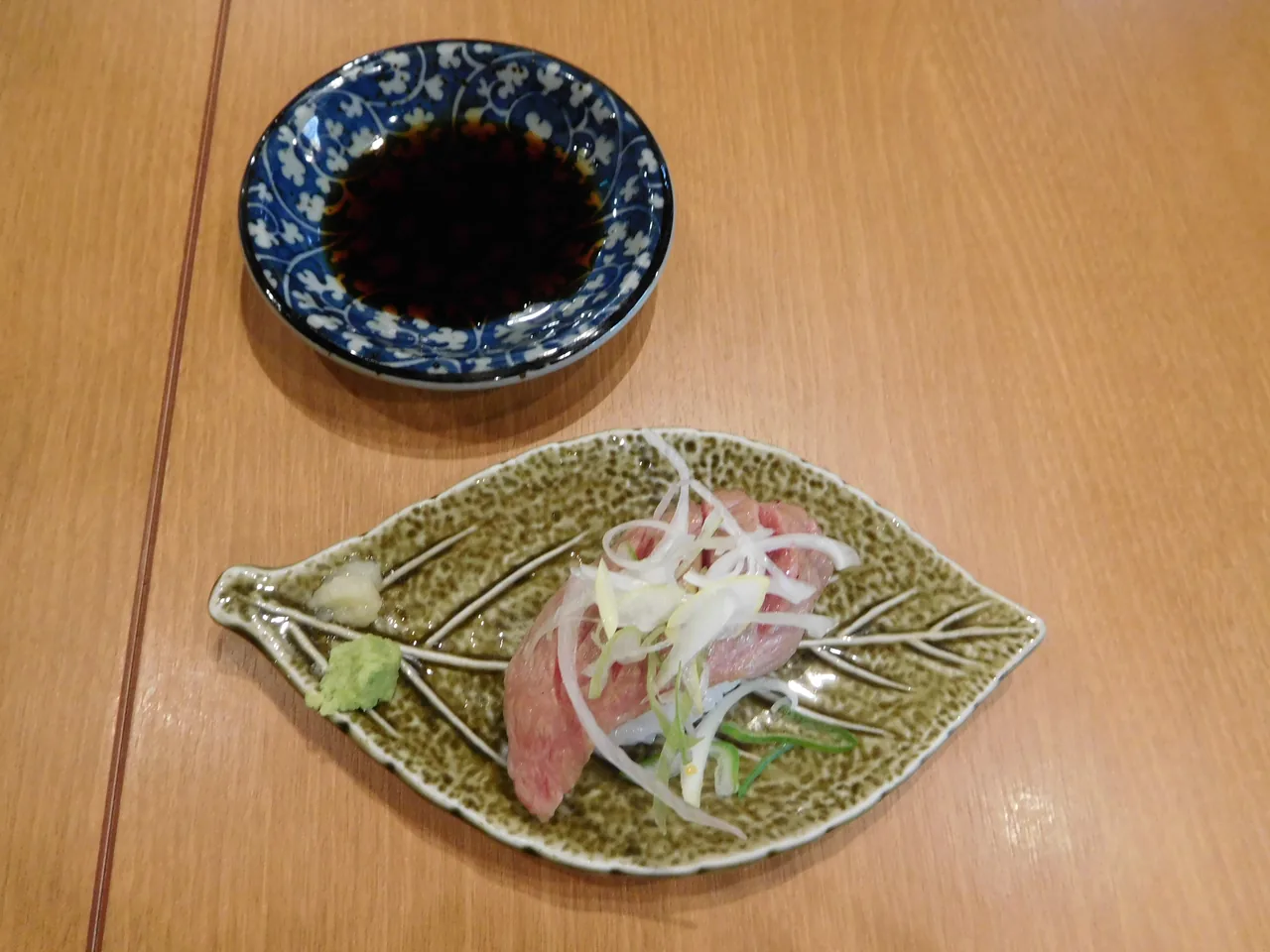 Hida beef sushi, seared slices of local wagyu served over rice
