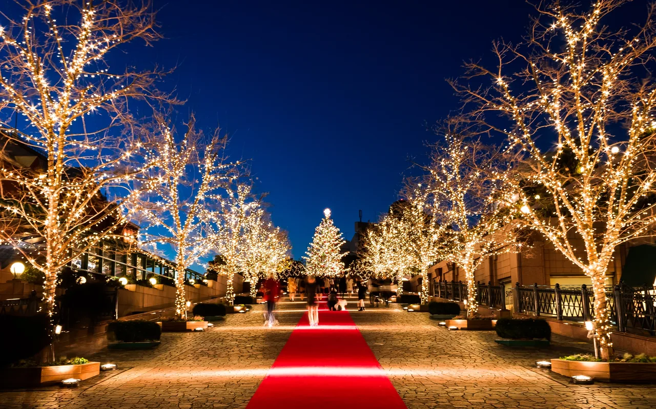 Ebisu Garden Place at night, with lit walkways and the buildings around the central square