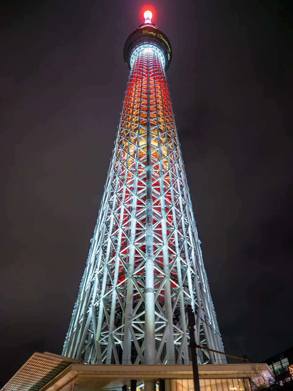 Tokyo Skytree lit for Christmas above the shops of the town complex at its base