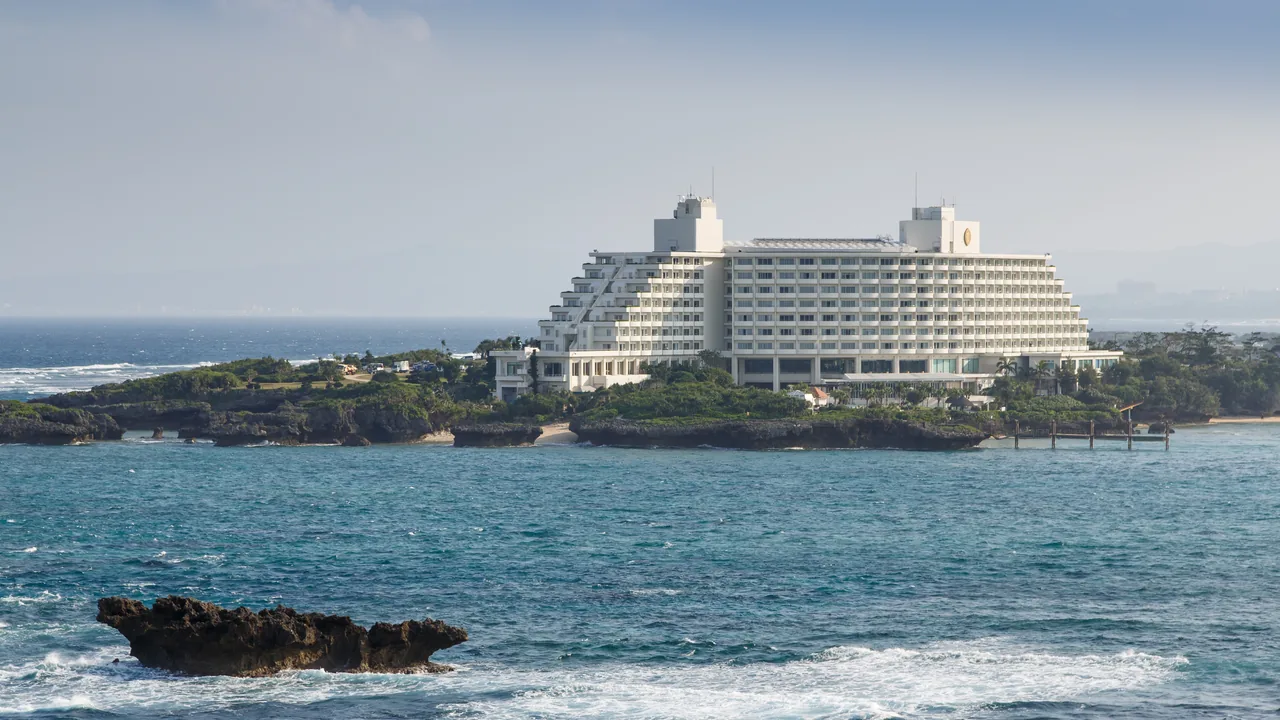 A large beachfront resort hotel on the coast at Onna in Okinawa A large beachfront resort hotel on the coast at Onna in Okinawa