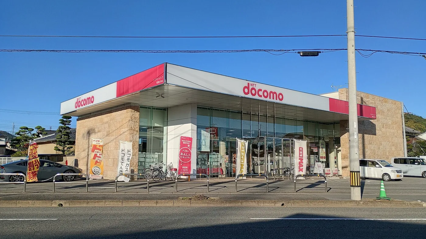 The storefront of an NTT Docomo shop on a Japanese street