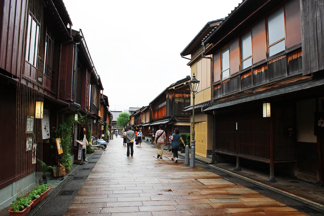 A street in the Higashi Chaya District lined with two storey wooden buildings with lattice fronts