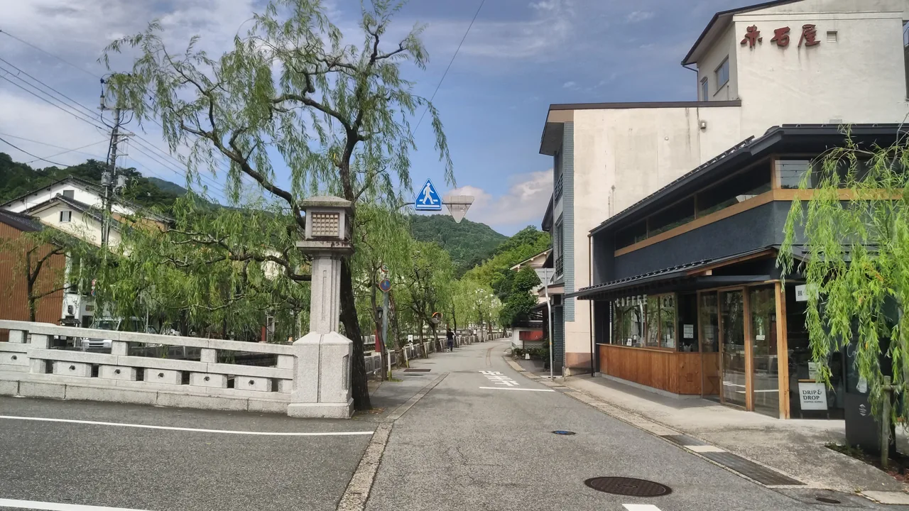 The willow-lined main street of Kinosaki Onsen, the town whose public baths all accept tattoos The willow-lined main street of Kinosaki Onsen, the town whose public baths all accept tattoos