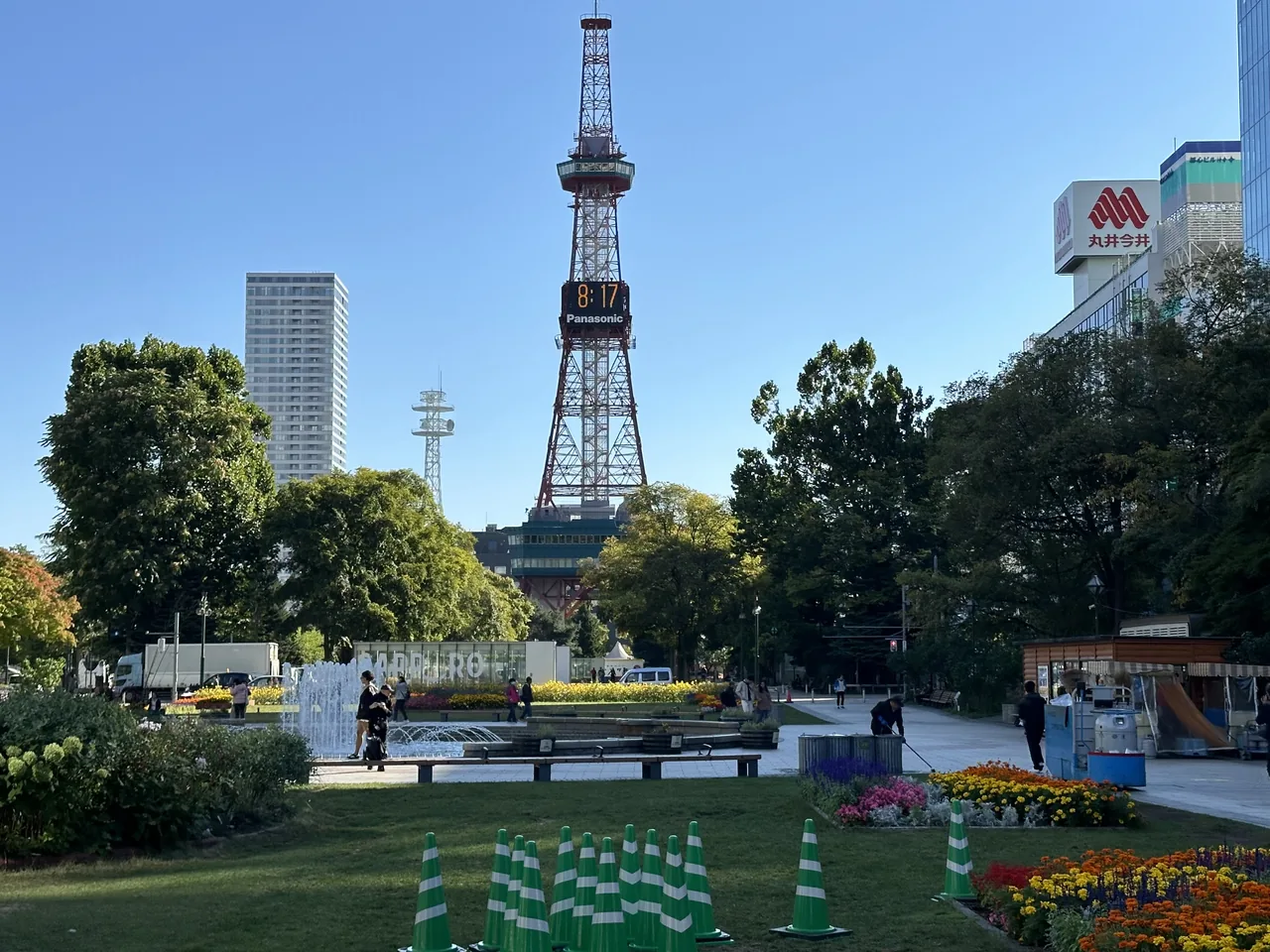 Odori Park in central Sapporo, with flower beds, a fountain and the Sapporo TV Tower behind