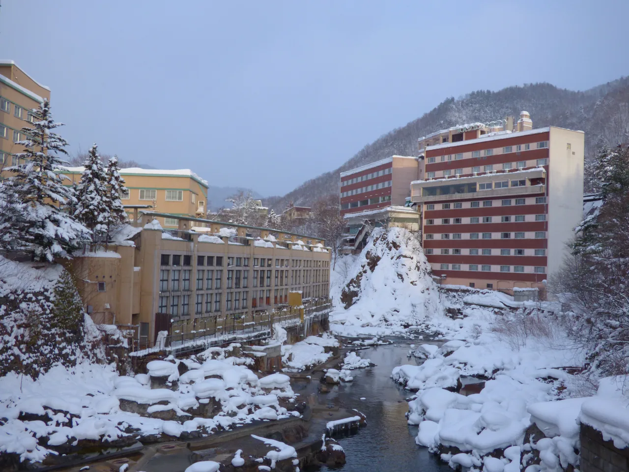 The Jozankei Onsen area in Sapporo's Minami ward, with hot spring lodgings along the wooded gorge of the Toyohira River.