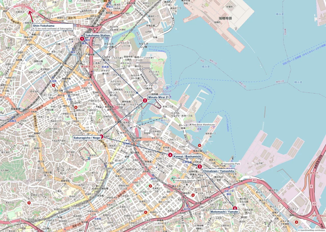 Map of central Yokohama marking Yokohama Station, Minato Mirai, Sakuragicho, Kannai and Chinatown, with an arrow pointing off the map to Shin-Yokohama