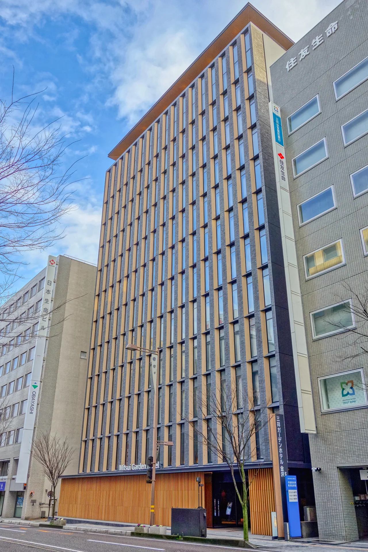 Mitsui Garden Hotel Kanazawa, a white-fronted hotel standing on a narrow street