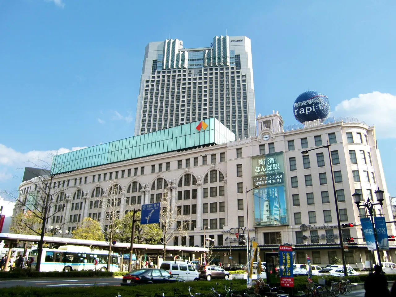 The open paved area in front of Namba station with the terminal building behind it