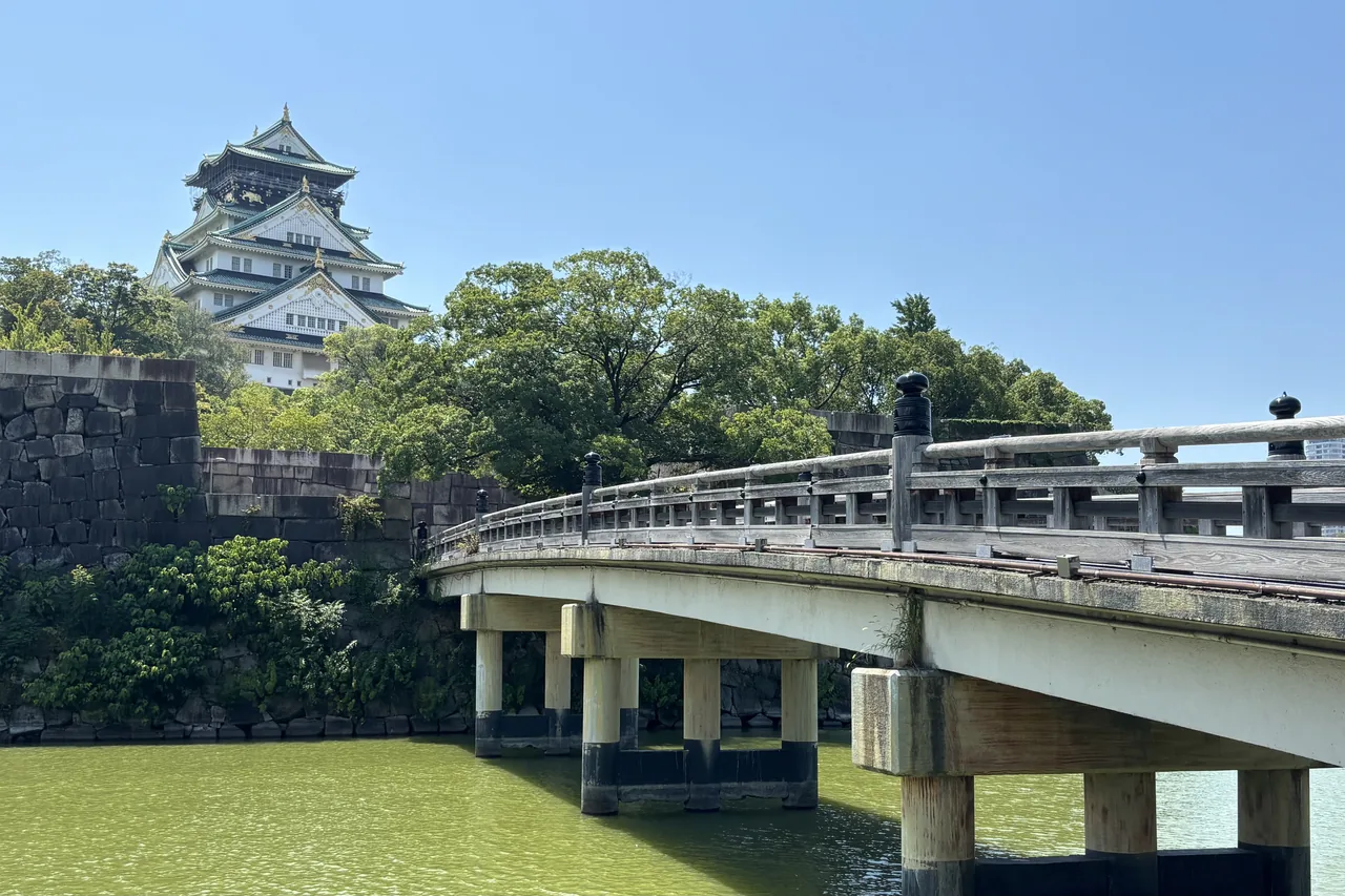 A bridge crossing the inner moat with the castle keep standing behind it