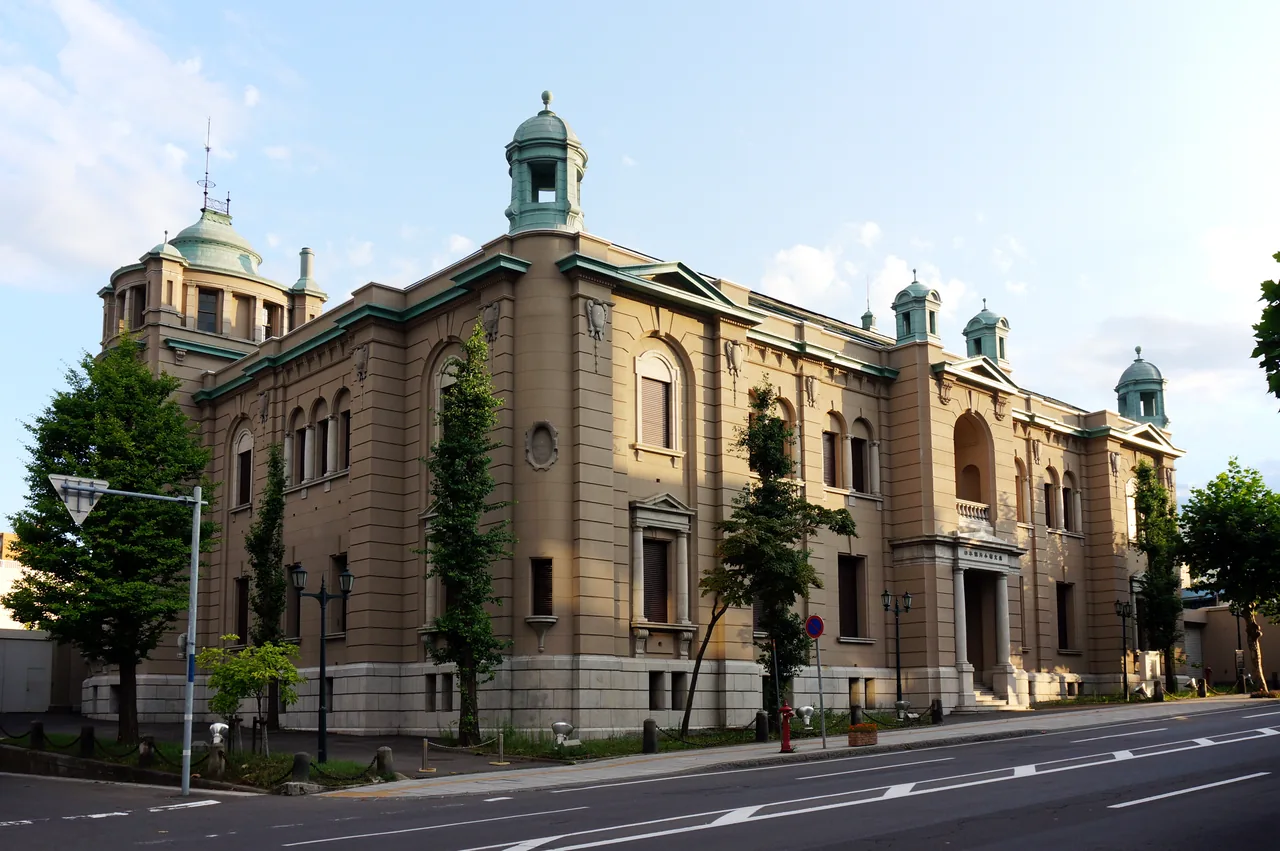 Front of a domed Western-style former bank building on a sunny day