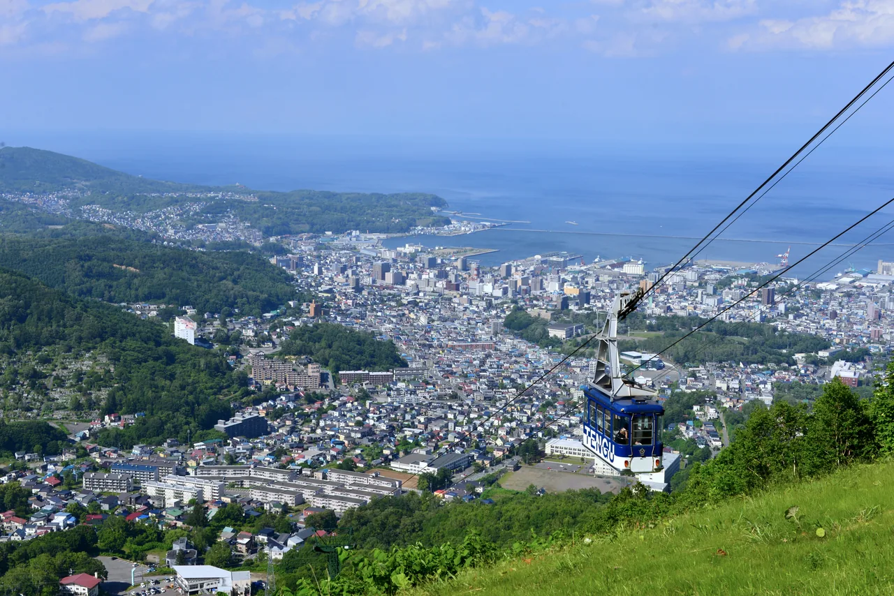 Ropeway cabin above Otaru town and the sea on a summer day