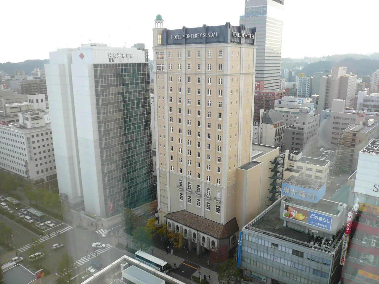 Central Sendai seen from above, with Hotel Monterey Sendai in the middle among office blocks and hills behind