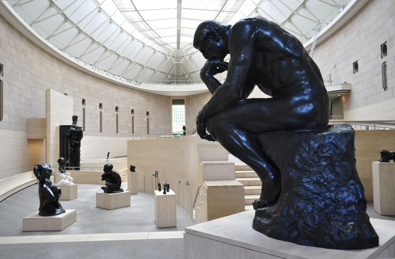 The Thinker in bronze inside the stone-walled Rodin wing of the prefectural museum