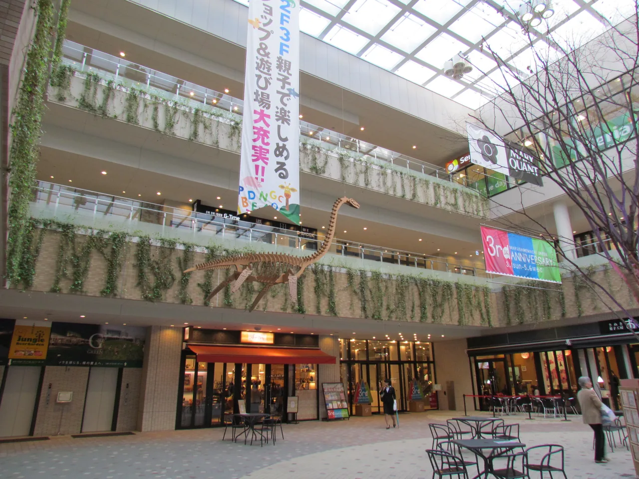 People walking under the glass roof of a covered shopping arcade in Takamatsu People walking under the glass roof of a covered shopping arcade in Takamatsu