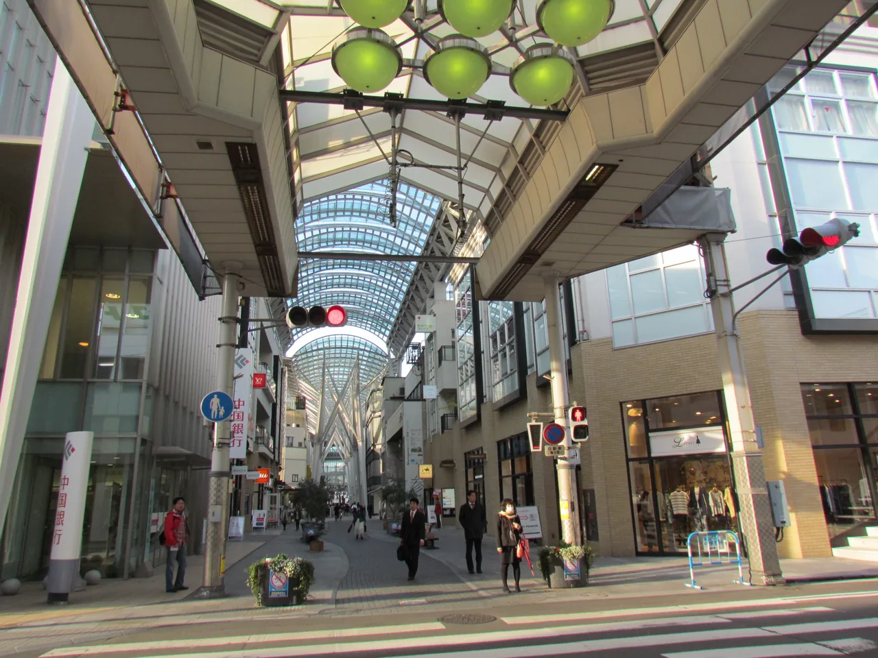 The glass-roofed Marugamemachi arcade in central Takamatsu with shoppers below