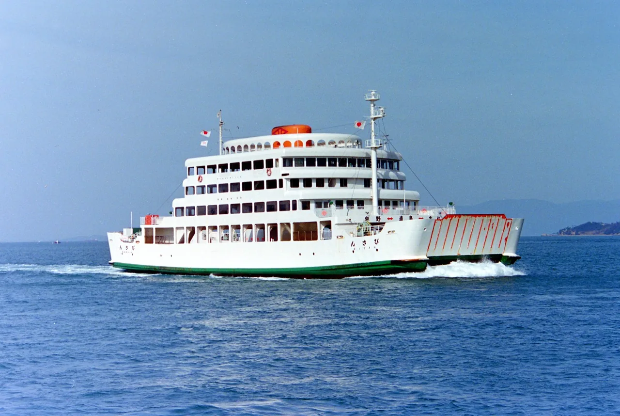 A white passenger ferry crossing calm water in the Seto Inland Sea