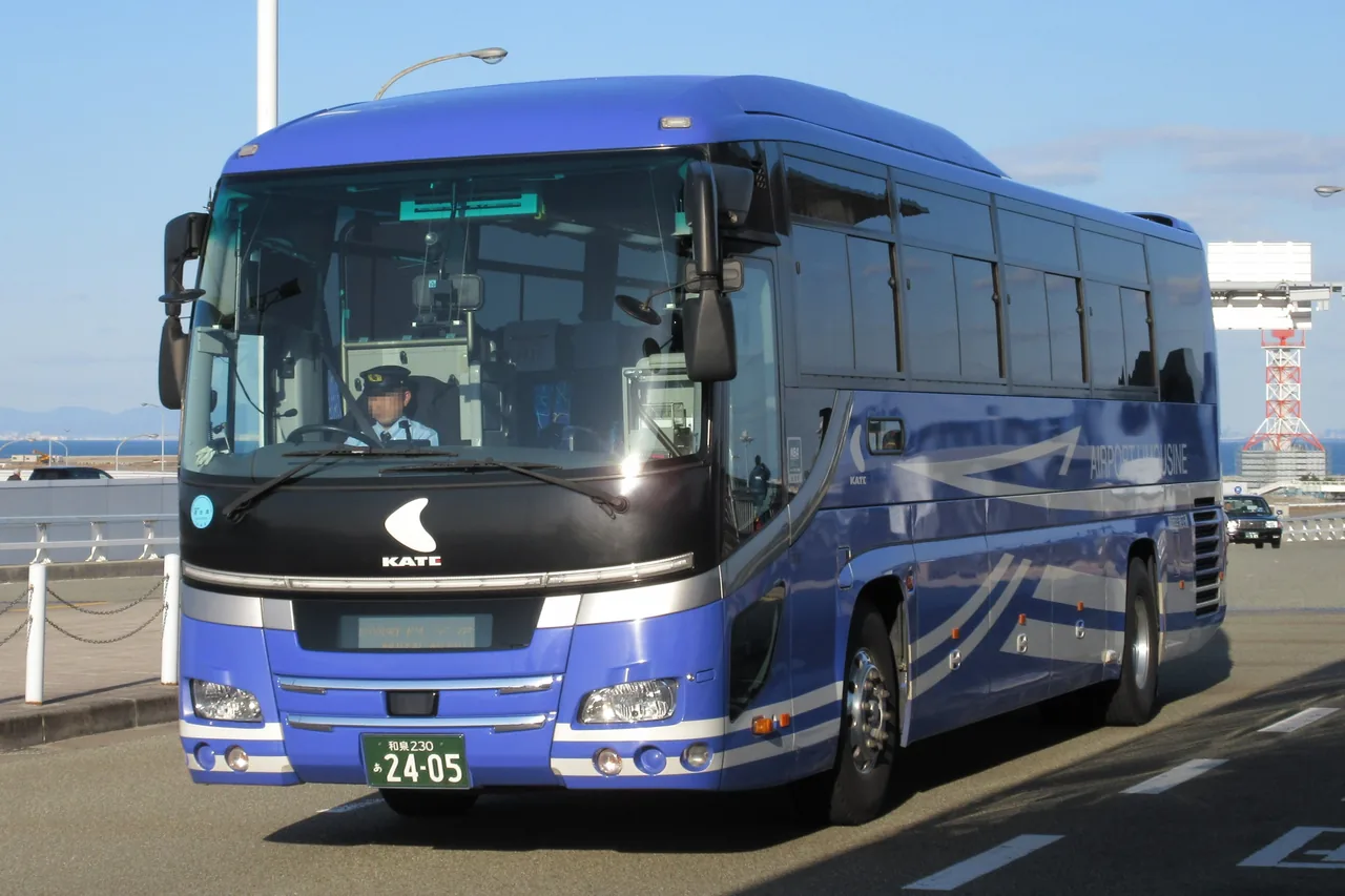 Blue airport limousine bus on an airport road